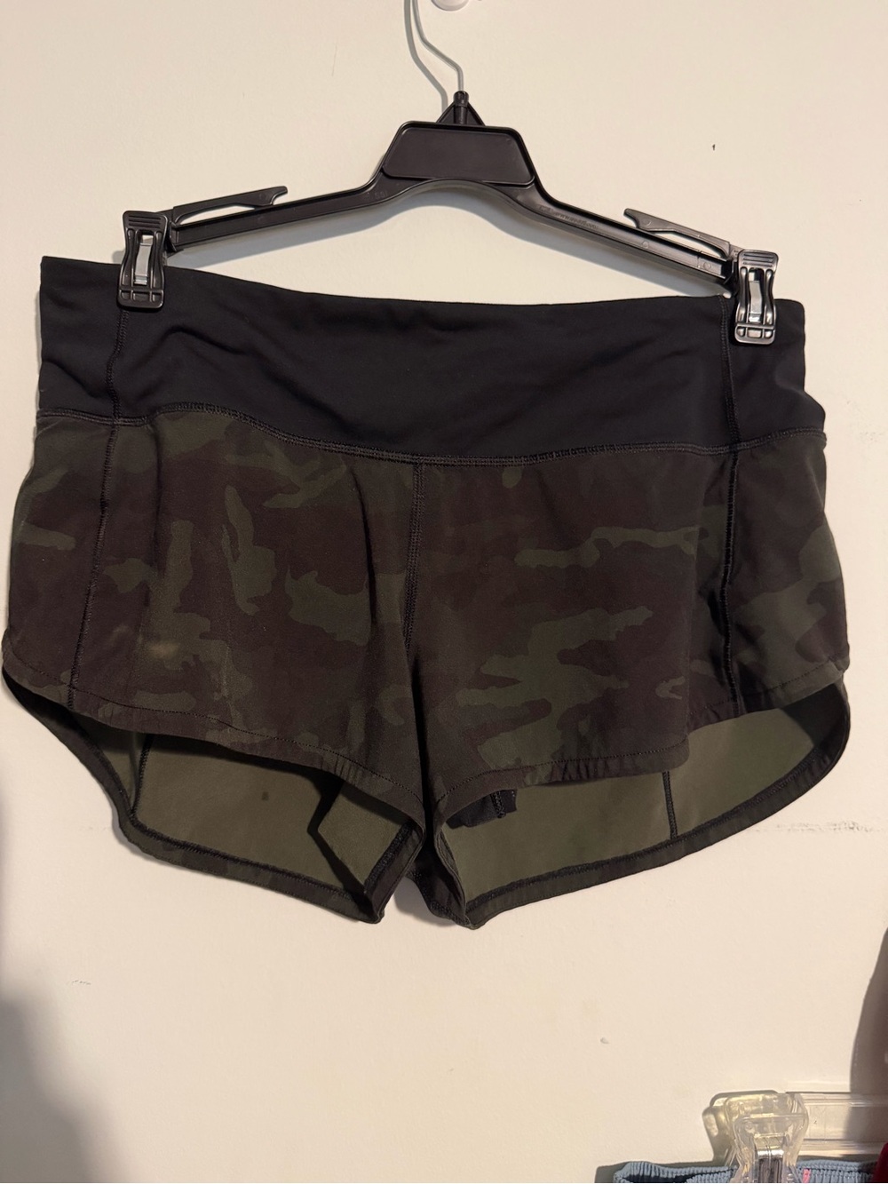 Lululemon Speed Up Shorts in a green and black camo print
